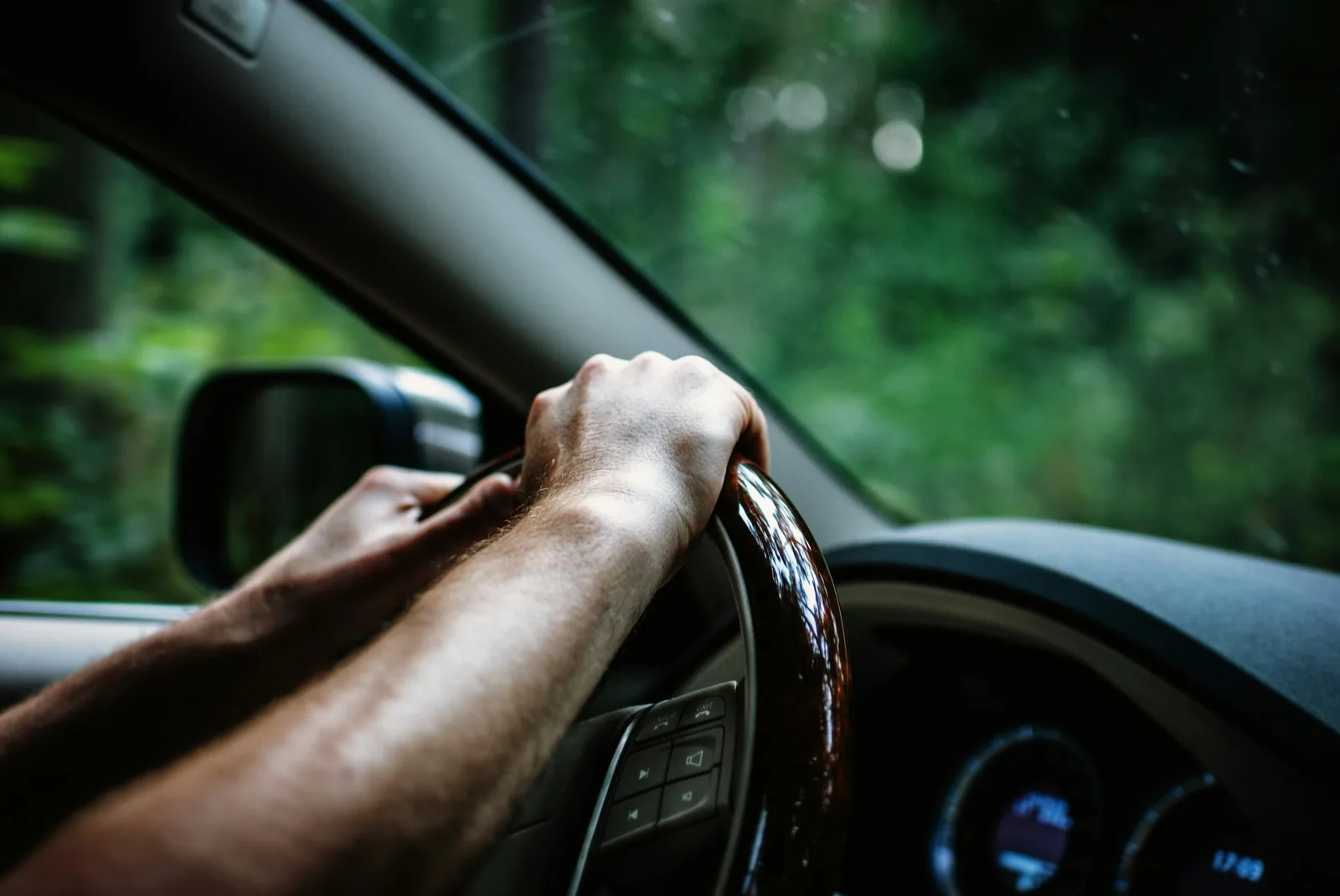 Driver hands on the steering wheel during a refresher driving lesson